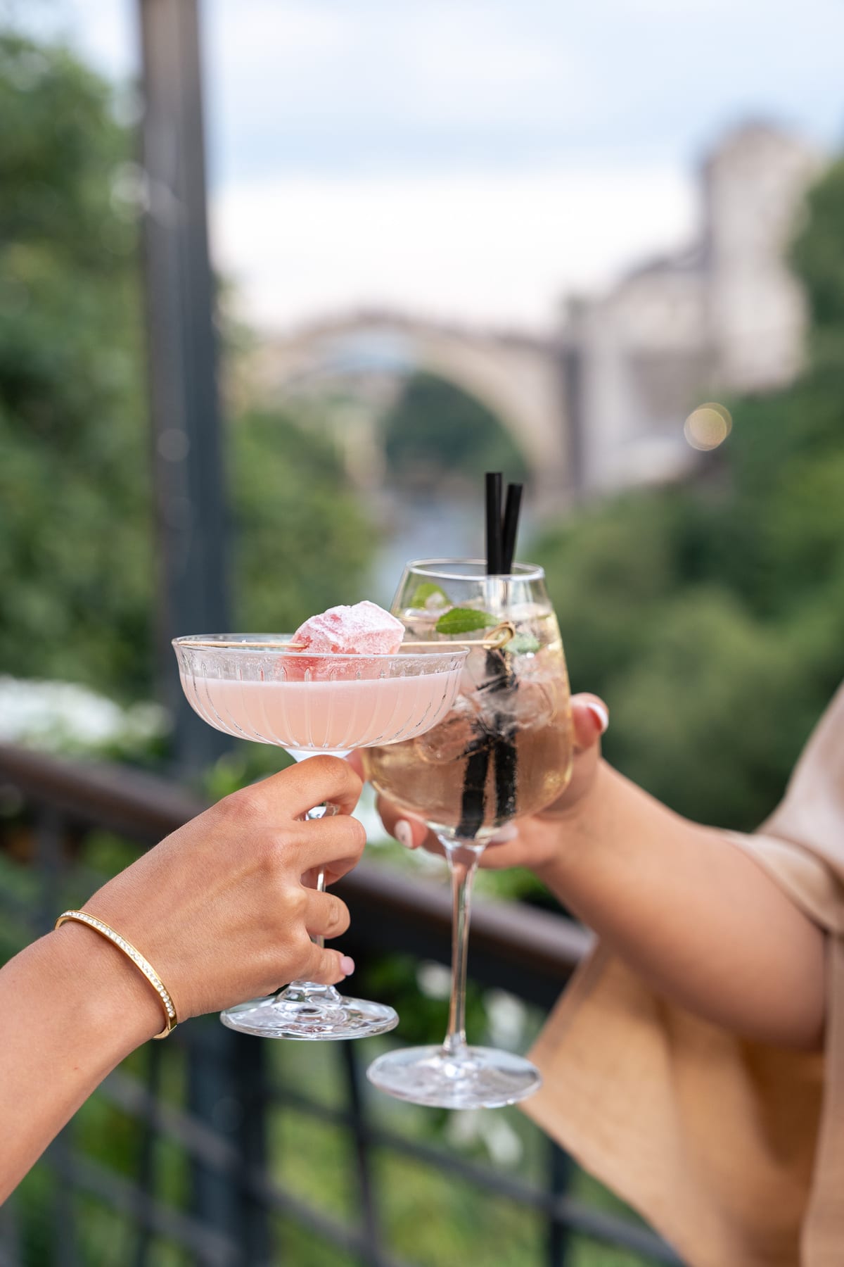 Toasting cocktails with a view of the Old Bridge